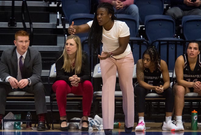University of Indianapolis women’s basketball assistant coach and defensive coordinator FahKara Malone, center, calls out a play as the Greyhounds play the University of Southern Indiana Screaming Eagles at Screaming Eagles Arena in Evansville, Ind., Saturday afternoon, Feb. 29, 2020.