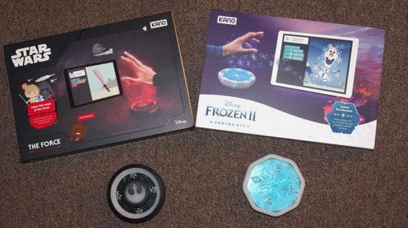 The Kano Star Wars The Force coding kit and the Kano Frozen II coding kit. Each coding kit comes with a control sensor unit that translates hand motions into coding actions.