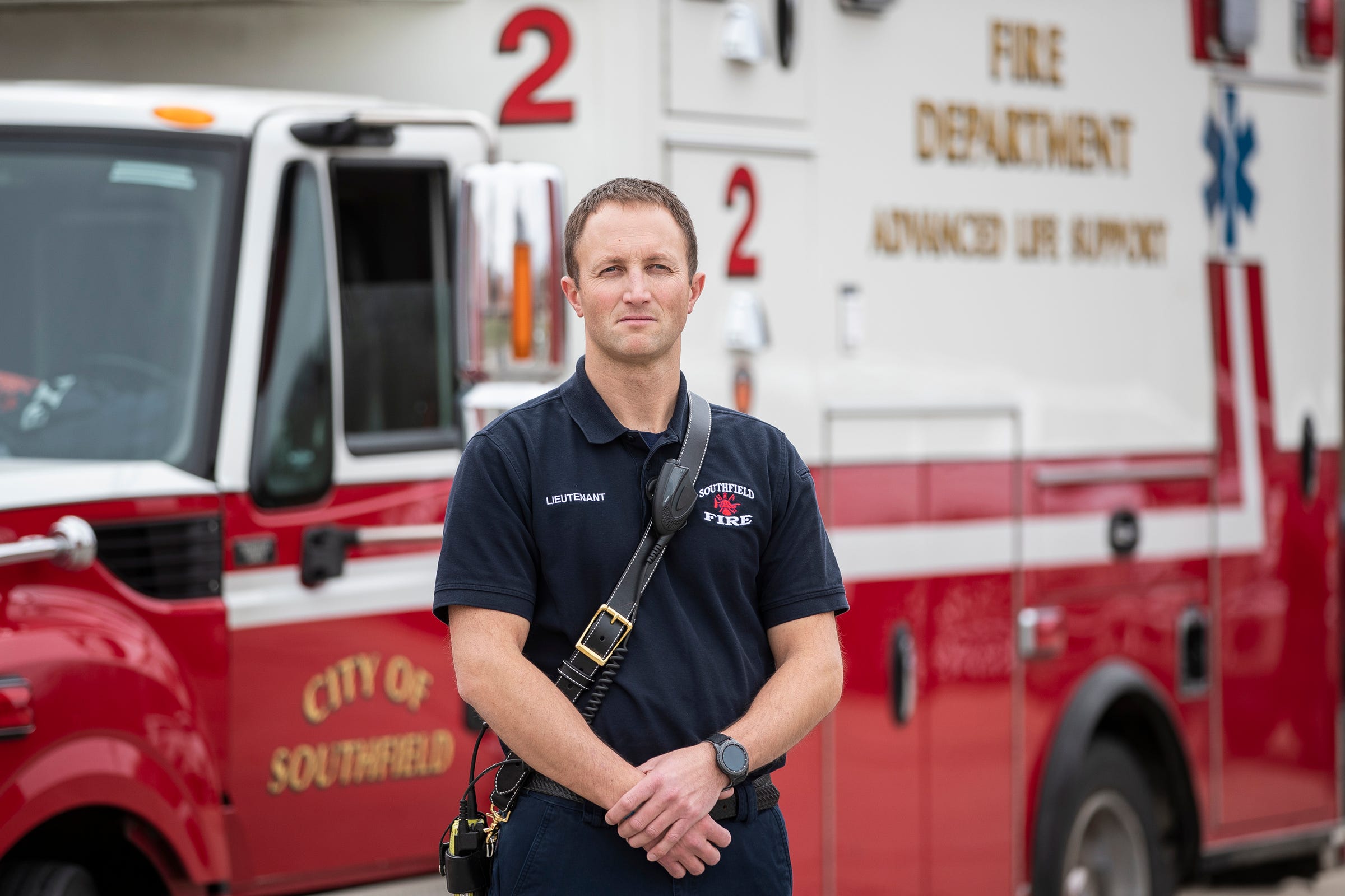 Lieutenant Erik Chesnut poses for a photo in front of his Life 2 vehicle at the Southfield Fire Department headquarter in Southfield, Thursday, March 26, 2020.