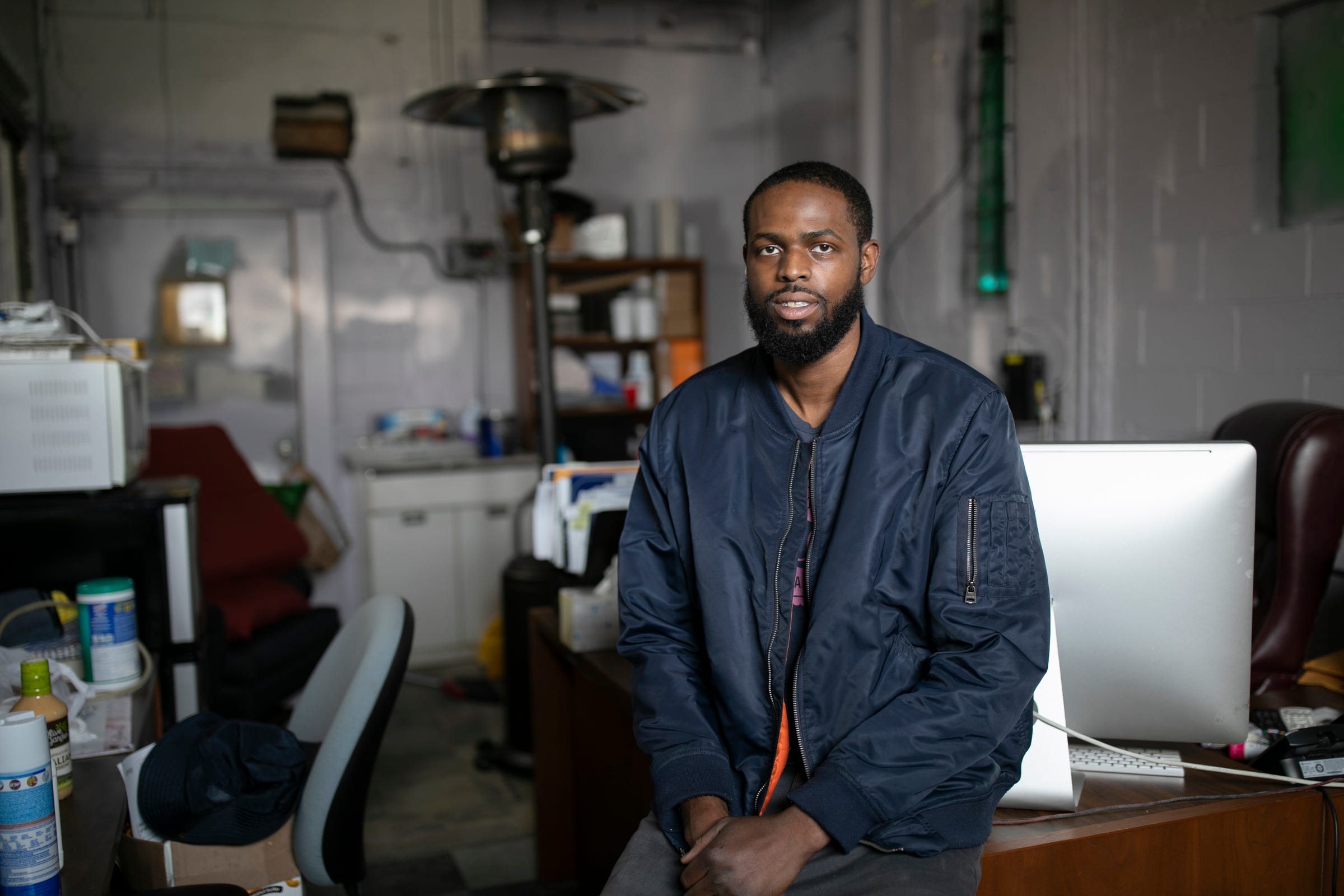 Jerrell Simmons, 27, of Detroit is a detail specialist and a carpet cleaner. Simmons subcontracts for Detroit Maid. Business has become uncertain for Simmons during the Coronavirus threat. Simmons poses for a portrait at his Detroit warehouse Wednesday, March, 25, 2020.