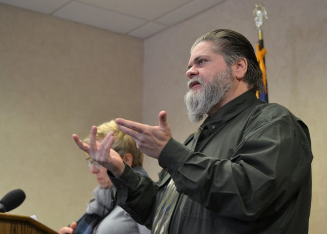 Rick Norris, the executive director of InterpreCorps, LLC., uses American Sign Language (left) during a press conference Friday, March 27, 2020, with city officials. He has been the go-to interpreter for the deaf and hard of hearing community whenever the city has given updates about the novel coronavirus pandemic's affects in the area.