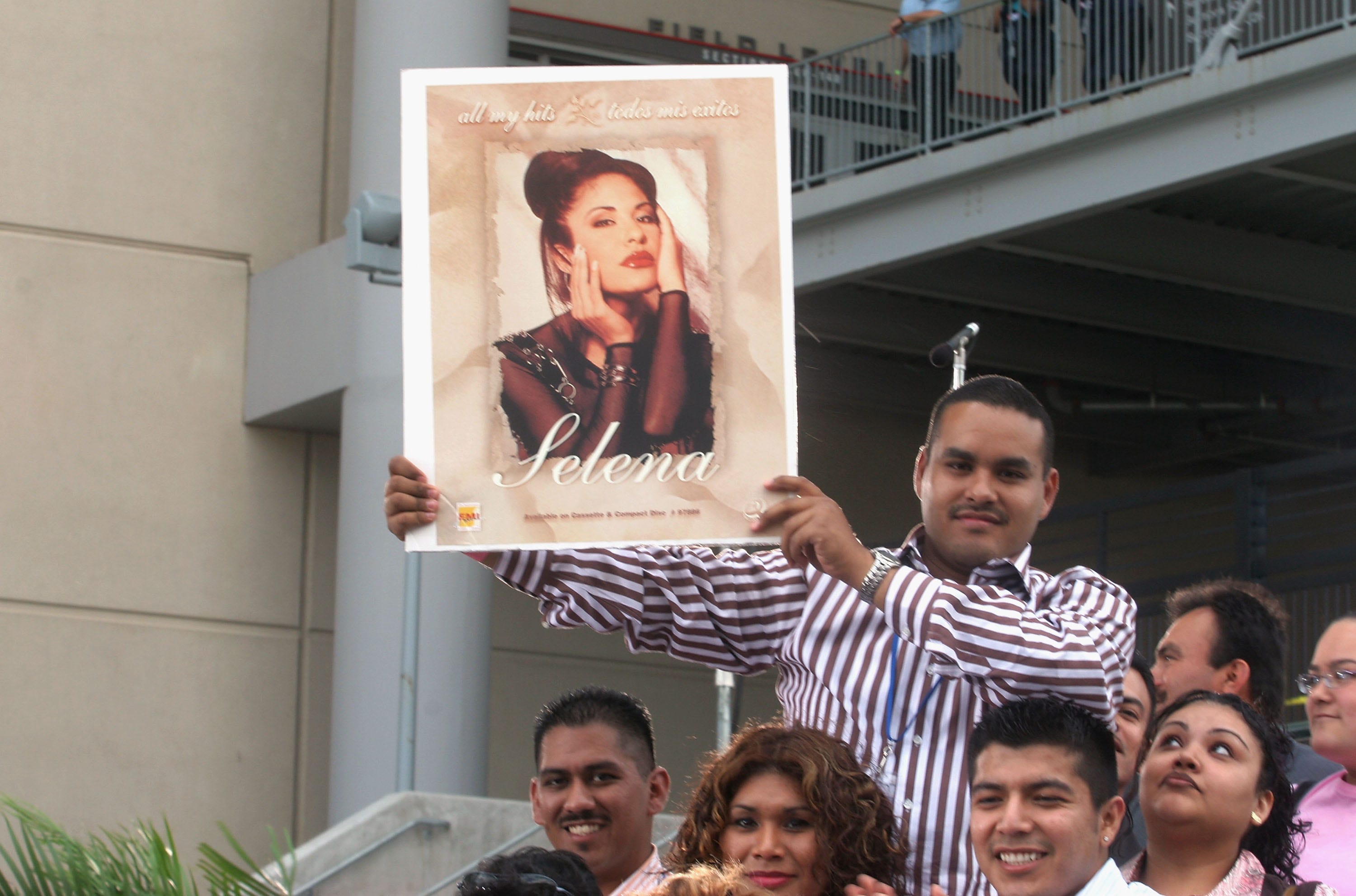 HOUSTON, TX - APRIL 7: Fans of Selena and Latin music  wait at the "Selena Vive" tribute concert, April 7, 2005, Reliant Stadium, Houston, Texas. Many of the stars of Latin music and television came to pay their respects and honor the memory of the pop star.  (Photo by Jana Birchum/Getty Images)