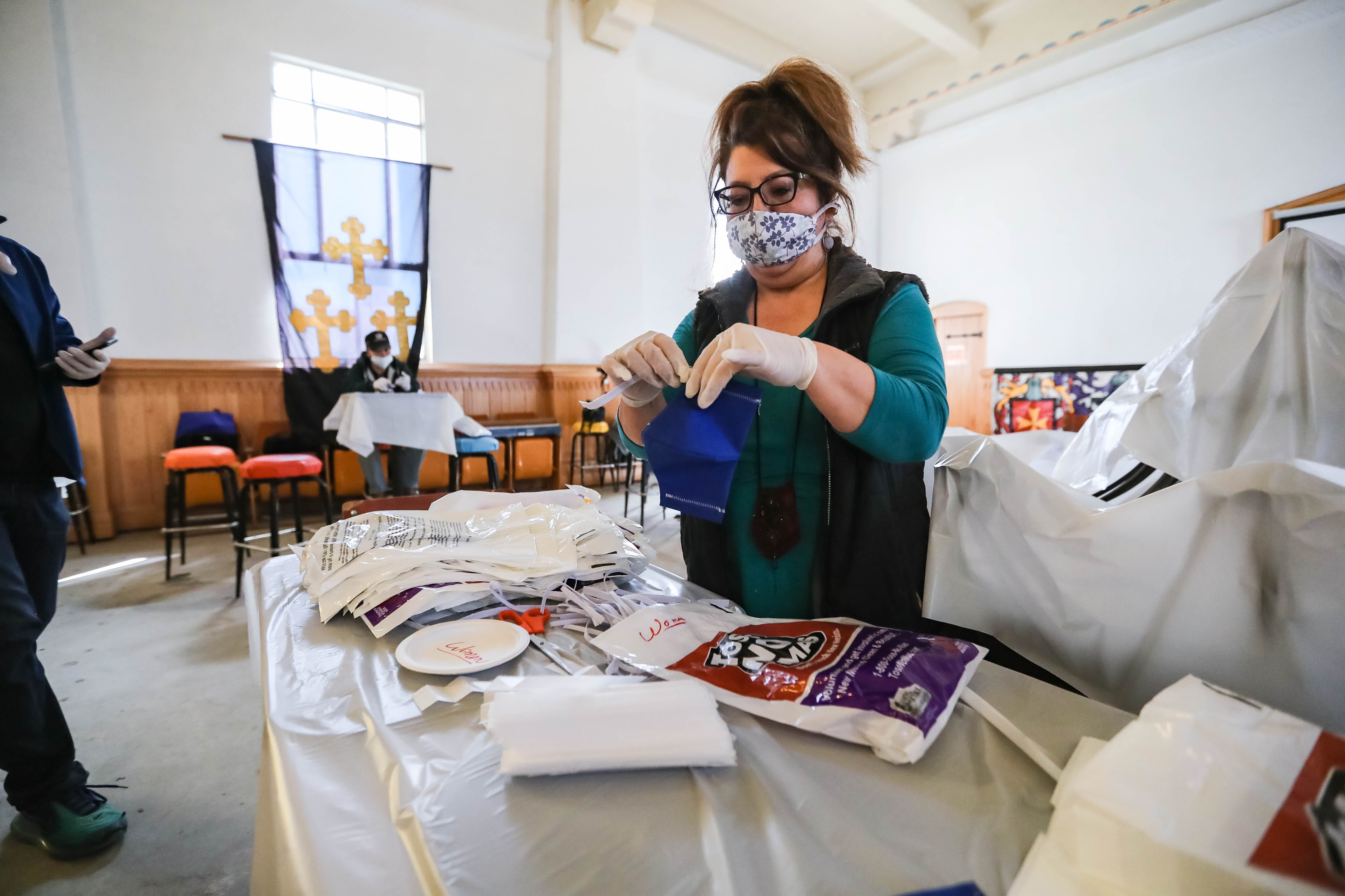 Volunteers make face masks at the historic Doña Ana County Courthouse in Downtown Las Cruces on Saturday, March 28, 2020.