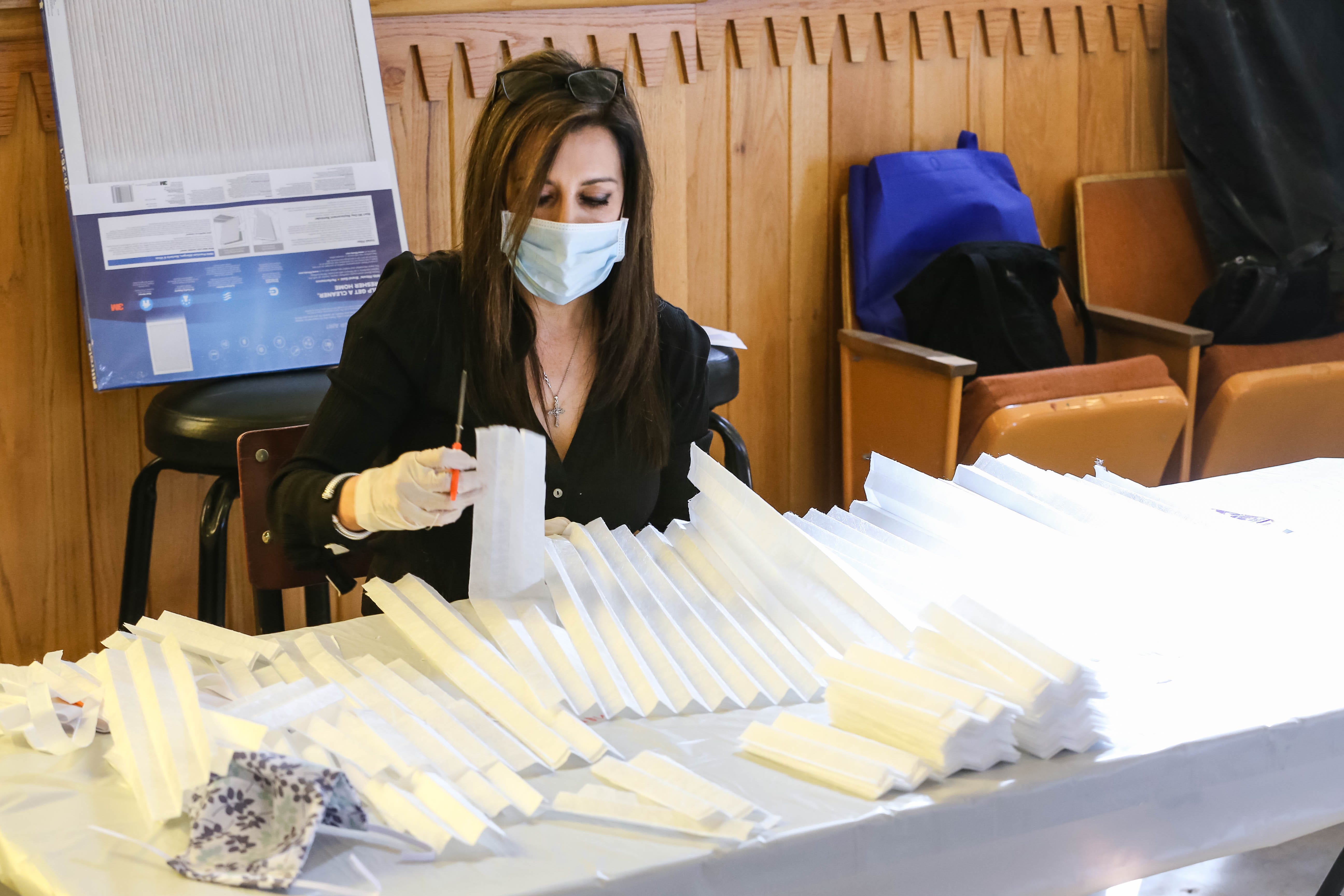 Volunteers make face masks at the historic Doña Ana County Courthouse in Downtown Las Cruces on Saturday, March 28, 2020.