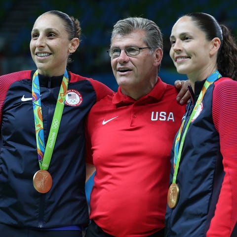 Diana Taurasi and Sue Bird pose for a picture with