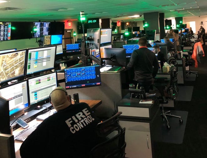 Licking County 911 dispatchers work in the new 911 Center in Heath while taking calls on March 20, during historic flooding in the area.