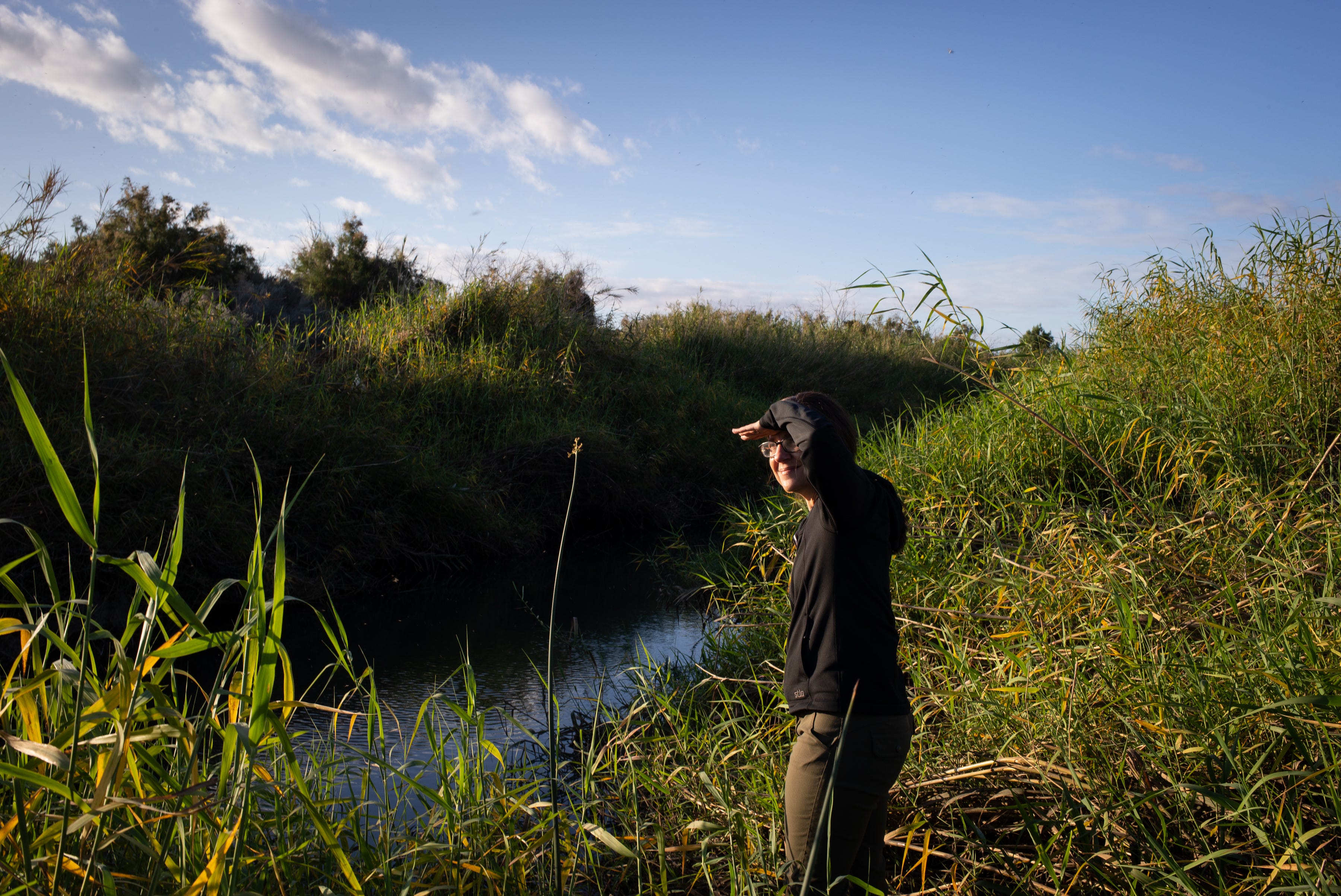 Jennifer Pitt, Colorado River program director for the National Audubon Society, stands by the Colorado River channel, just south of Morelos Dam in Mexico on March 2, 2020.