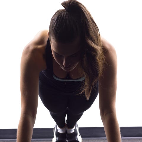 Showing excellent form at the start of a push up.