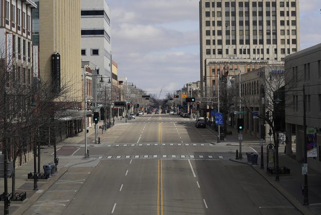The streets and sidewalks of downtown Appleton lack their normal buzz of activity amid the stay-at-home order to slow the spread of the coronavirus.