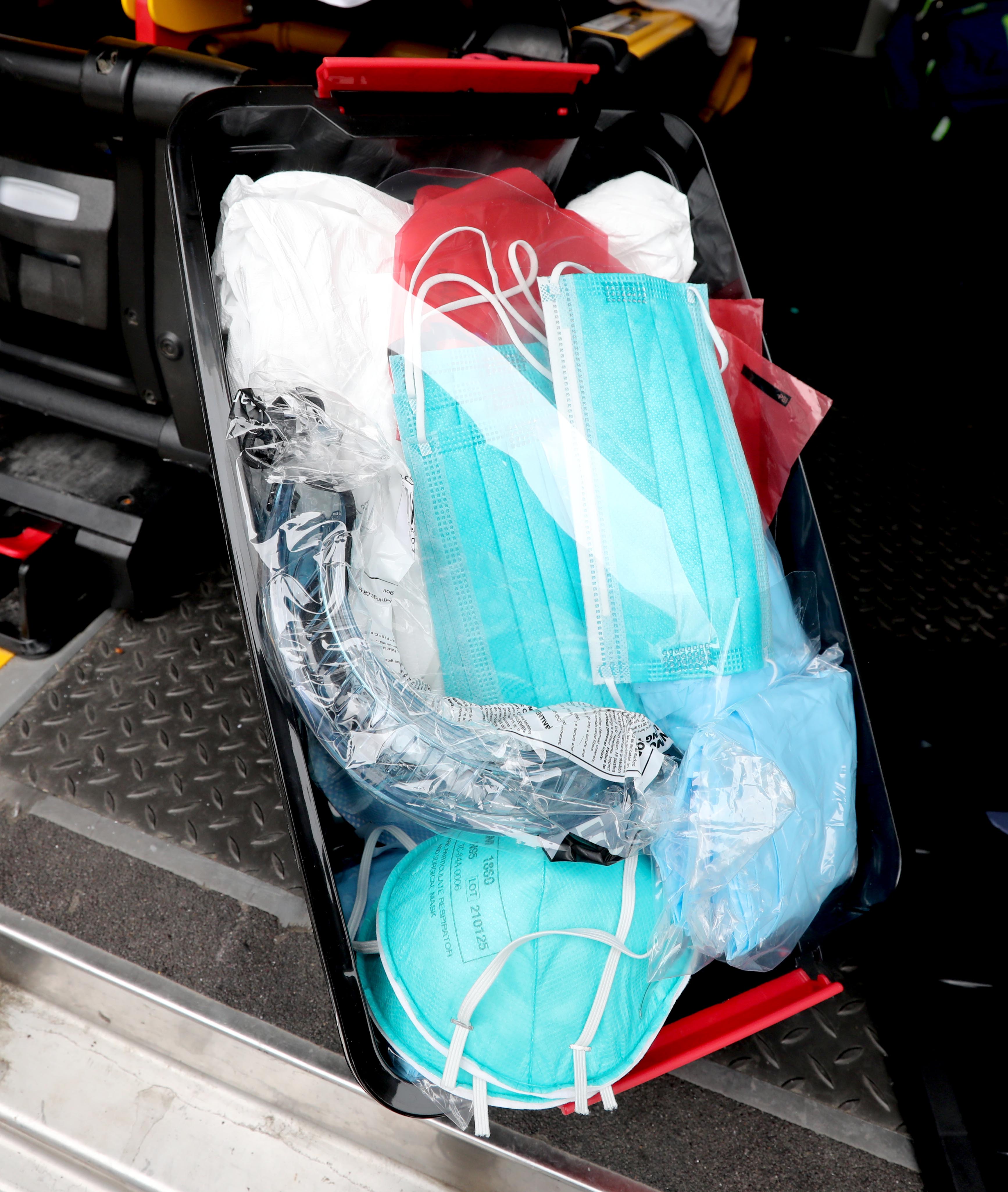 A package of protective gear that all Town of Greenburgh paramedics and EMT's bring with them on emergency calls photographed March 31, 2020. The gear consists of several types of protective masks, gowns, and goggles. Jared Rosenberg, Paramedic Supervisor, says that over the past month, over thirty percent of emergency calls have been COVID-19 related.