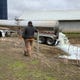 The Elbe family, of West Bend, watch as the milk from their farm is dumped Wednesday.