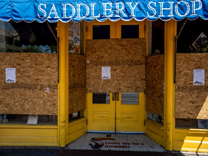 Rula Bula, an Irish pub in downtown Tempe, is boarded up for temporary closure on the first full day of Arizona Gov. Doug Ducey's statewide 
