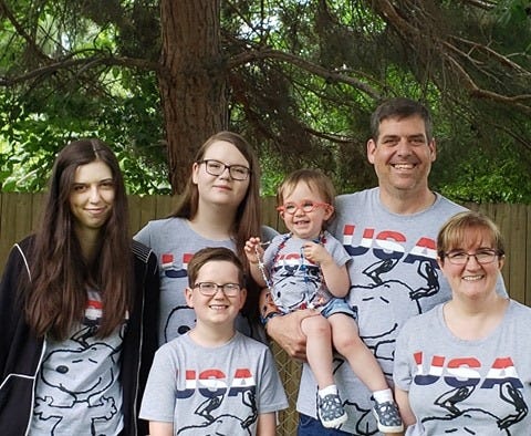 Brian Garrett is pictured with his wife, Rebecca, and children, Savannah, Emilie, Graham and Grace. Brian died Tuesday at the age of 45 of complications believed to be linked to coronavirus.