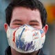 Nicholas Medlock, security with IndyGo, wears a patriotic face mask as he works at the Julia M. Carson Transit Center, Wednesday, April 1, 2020.