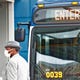 A rider dons a face mask and waits for his IndyGo bus at the Julia M. Carson Transit Center, Wednesday, April 1, 2020. Riders are asked to enter and exit through the rear door, unless they need ramp access. Fares are suspended at this time.