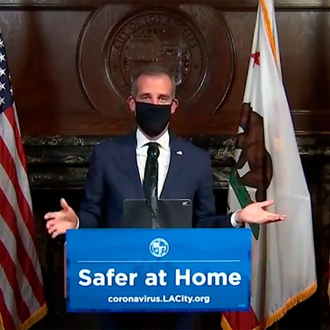 Los Angeles Mayor Eric Garcetti wears a face mask 
