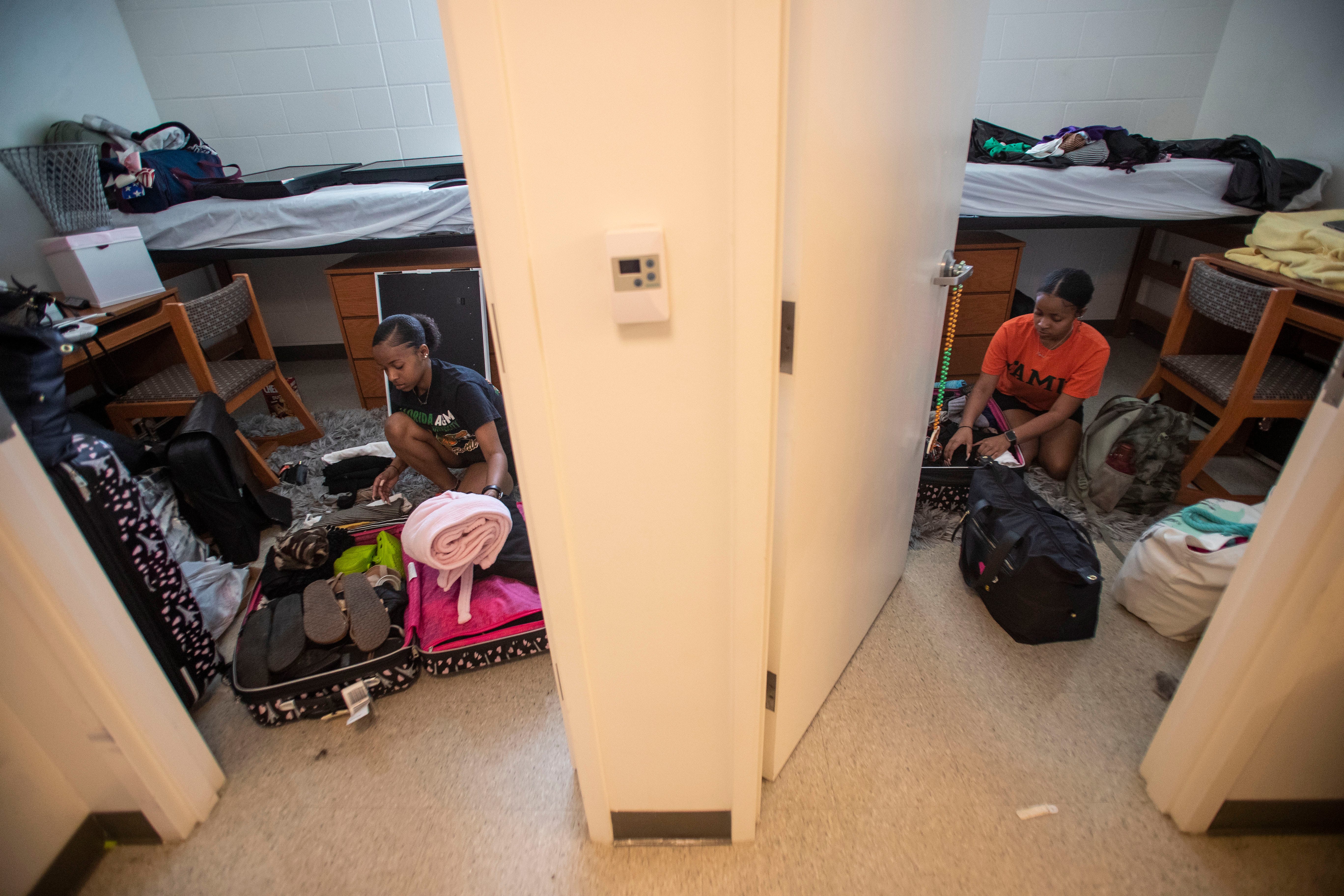 Florida A&M University freshmen twin sisters, Jaelen and Jazlen Patrick, 18, pack up their belongings in their dorm room on Tallahassee, Fla. on March 20, 2020. They were informed the remainder of the spring semester would be conducted online.