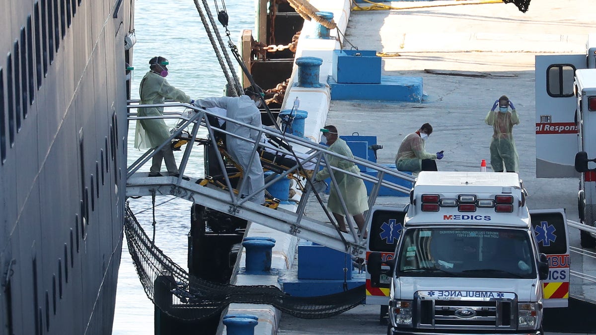 A patient is taken off the the Zaandam cruise ship after it arrived at Port Everglades on April 2, 2020 in Fort Lauderdale, Fla. The Holland America cruise ship had been at sea for the past 19 days after South American ports denied their entry due to the coronavirus outbreak. Reports indicated that two of four people that died aboard the Zaandam had  tested positive for COVID-19.     