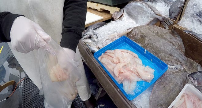 Fresh fish is sold during the outdoor market at Shore Fresh Seafood Market in Point Pleasant Beach Friday, April 3, 2020.
