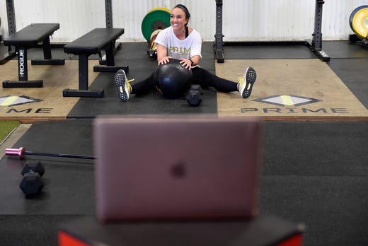 Dani Martinez films live training sessions for her clients, Friday, April 3, 2020, at Prime 361 Performance. Martinez trains more than 100 athletes in the Corpus Christi area as well as the strength and conditioning coach at Banquete High School.