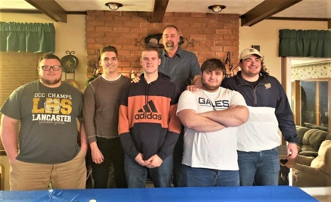 Lancaster track and field throwers had a preseason dinner for the seniors, their parents. The seniors, standing with their coach, Jack Cheek, from left to right, are Dalton Golden, Adam Nebbergall, Bryse Roush, Noah Burnside and Bryann Connell.