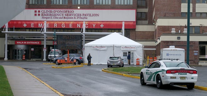 Walk in patients to Monmouth Medical Center in Long Branch enter through a tent outside the emergency room.