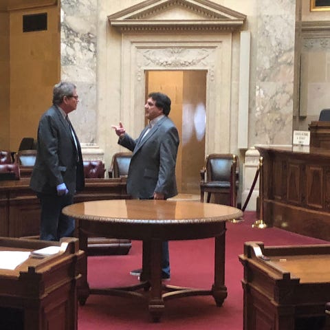 State Sen. Tim Carpenter, left, talks to Senate Cl