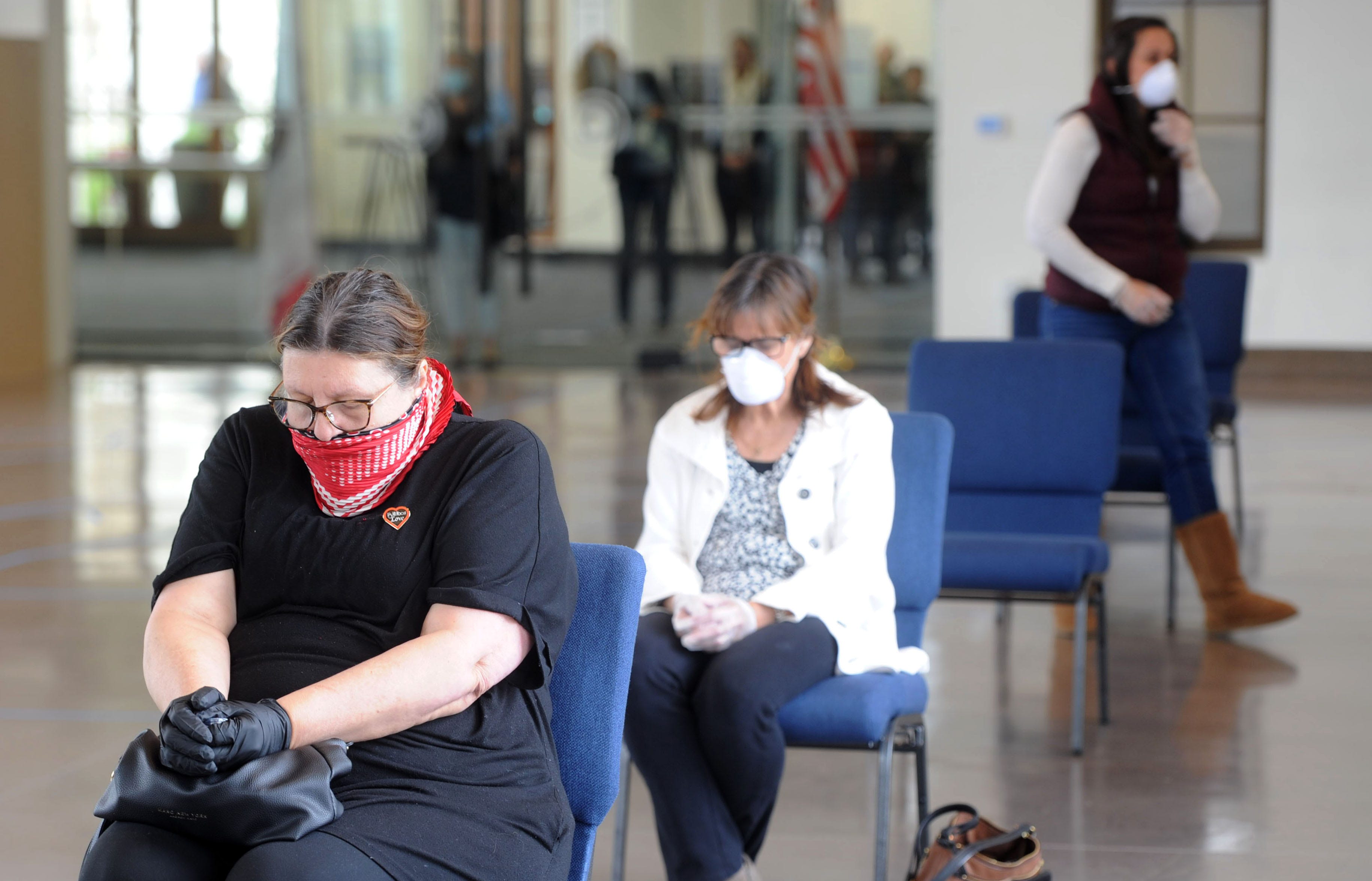 Sylvie Lariviere-Traub prays after Communion at Godspeak Calvary Chapel in Newbury Park April 5, 2020. Despite stay-at-home orders, the chapel opened its doors from 1 p.m. - 3 p.m. on Palm Sunday for members although church leaders used social distancing practices.