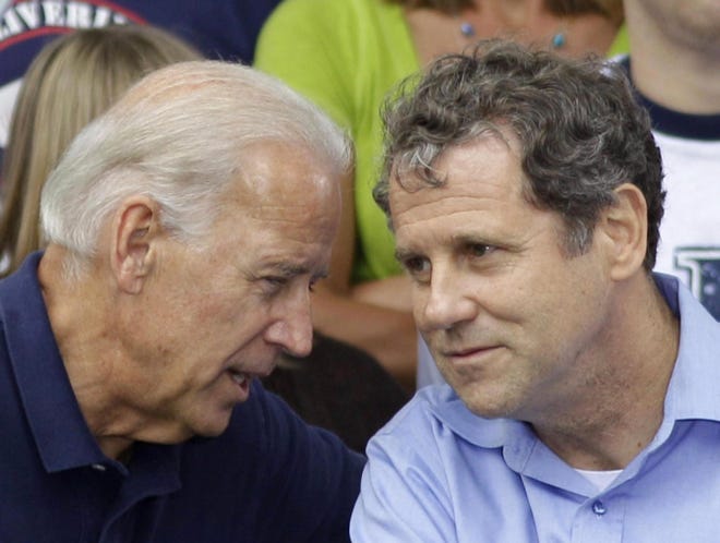 Vice President Joe Biden, left, speaks with Sen. Sherrod Brown, D-Ohio, at an AFL-CIO Labor Day picnic in 2011, at Coney Island in Cincinnati.