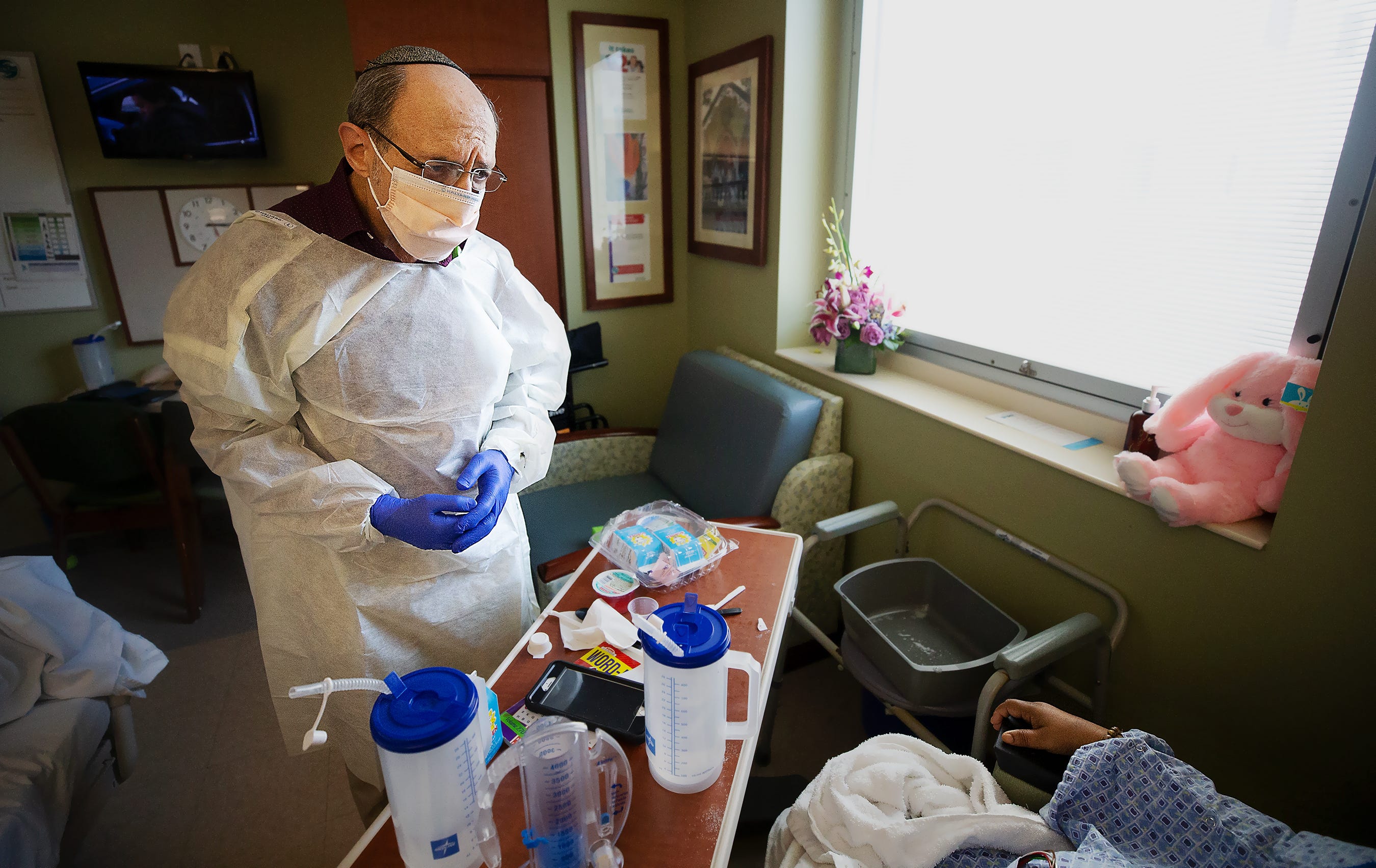 "Yes. I will pray for you," Chaplain Michael Schorin tells a COVID-19 patient who requested spiritual comfort at Gulf Coast Medical Center in Fort Myers, Florida. Schorin says he's been praying a lot lately. "God hasn't forgotten you," Schorin told the patient before leaving.