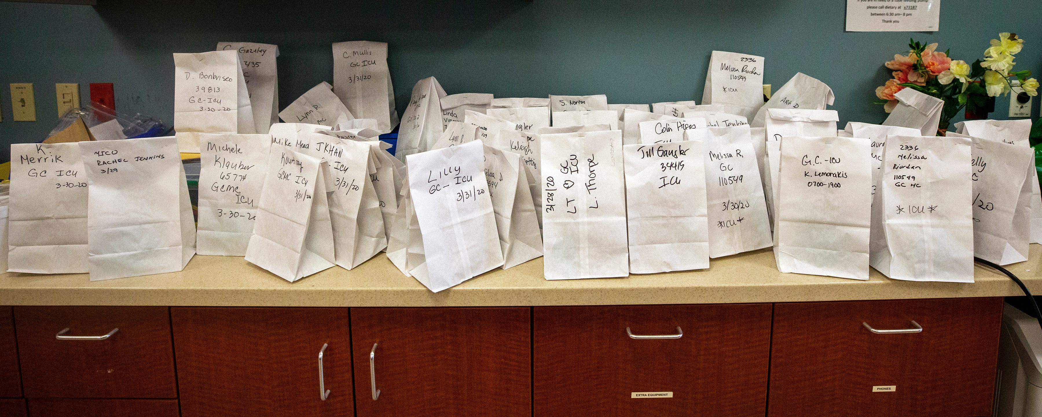 Bags containing sterilized N95 masks await pick up by nurses and doctors at Gulf Coast Medical Center in Fort Myers, Florida. Masks can be recycled twice before they are thrown away.