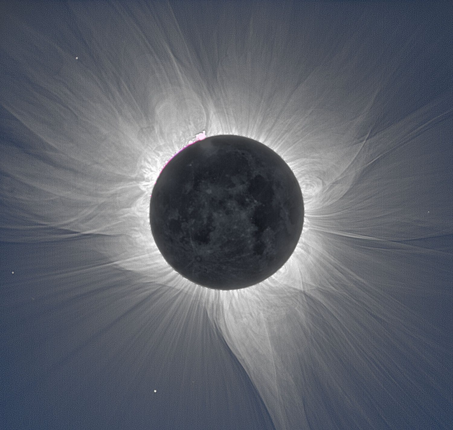 Image of the Sun's corona during a total eclipse. This area of plasma, or highly ionized gas, extends thousands of kilometers above the Sun’s visible surface, and is much hotter than the Sun itself with temperatures ranging from 1.7 million degrees Fahrenheit to more than 10 times that. Because of the brightness of the Sun, the corona is extremely hard to see from Earth except during a total solar eclipse. During totality, when the Moon perfectly blocks all of the light from the Sun, the corona appears as a white gossamer curtain emanating from the Sun.