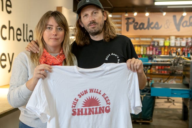 Ashley Busenius Coy and her husband Glen are heading up the #KeepShiningPSP fundraiser to support local businesses and hospitality workers. They are photographed inside their Windmill City Screen Printing shop in Cathedral City, Calif., on April 7, 2020. 