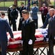 The flag draped casket of Phoenix police commander Greg Carnicle is carried to the hearse from St. Jerome's Catholic Church in Phoenix following Carnicle's funeral service on April 7, 2020. Carnicle was killed in a shooting on March 29. 