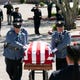 The flag draped casket of Phoenix police commander Greg Carnicle is carried by the Phoenix police honor guard outside of St. Jerome's Catholic Church in Phoenix before Carnicle's funeral service on April 7, 2020. Carnicle was killed in a shooting on March 29. 