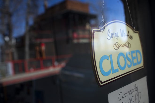 A shop hangs a closed sign in Jerome on April 7, 2020. Many shops in the Arizona tourist destination town were closed due to the COVID-19 pandemic.