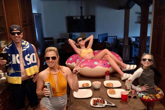 Joe, Betsy, Halle and Hayden Weber eat dinner together during their pool party-themed dinner night.