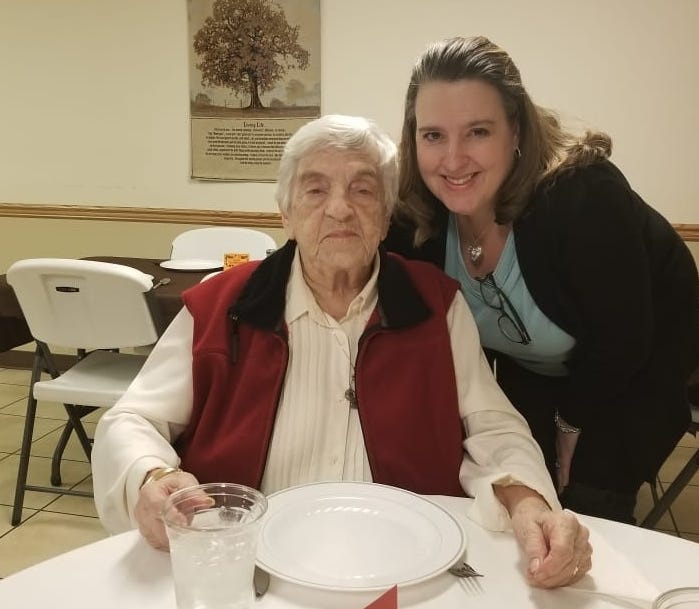 Lee Anne Teague (right) poses for a photo with her grandmother, Jean Massamore during a Thanksgiving meal at Massamore's Kentucky nursing home in November 2019. Massamore passed away April 4 after testing positive for the coronavirus.