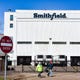 Smithfield Foods, Inc. employees wear masks as they leave at the end of their shift on Wednesday, April 8, at the food processing plant in Sioux Falls. 