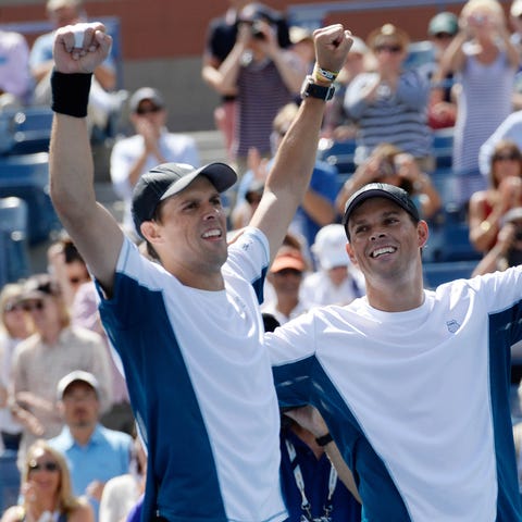 Mike Bryan and Bob Bryan after winning the men's d