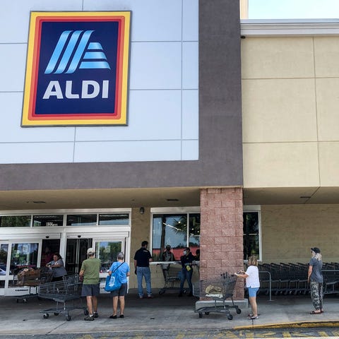A line forms outside the Aldi grocery store on Pal