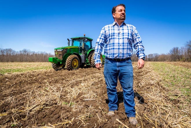Matt Nilson, Director of Business Operations for Golden Plain Farms, surveys a field being plowed for bell pepper planting on April 8, 2020 in Watervliet, Mich. Farmers across the state say they are concerned about not getting migrant labor from Mexico they need this year because of the coronavirus outbreak.