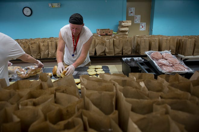 Michael Yantis and a volunteer prepared 300 sandwiches to be handed out at dinner at the Salvation Army on a Wednesday evening in April. Since mid-March, the Salvation Army in Licking County has served over 100,00 meals in response to the COVID-19 pandemic, and provided thousands of PPE kits.