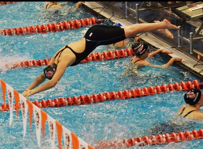 Port Clinton's Elena Kessler dives into the pool.