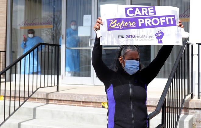 Saran Walker protests along with the SEIU Michigan Healthcare union for working conditions at the Ambassador nursing home on April 9, 2020, in Detroit. Workers at the home were just recently given the necessary PPE needed to treat patients.