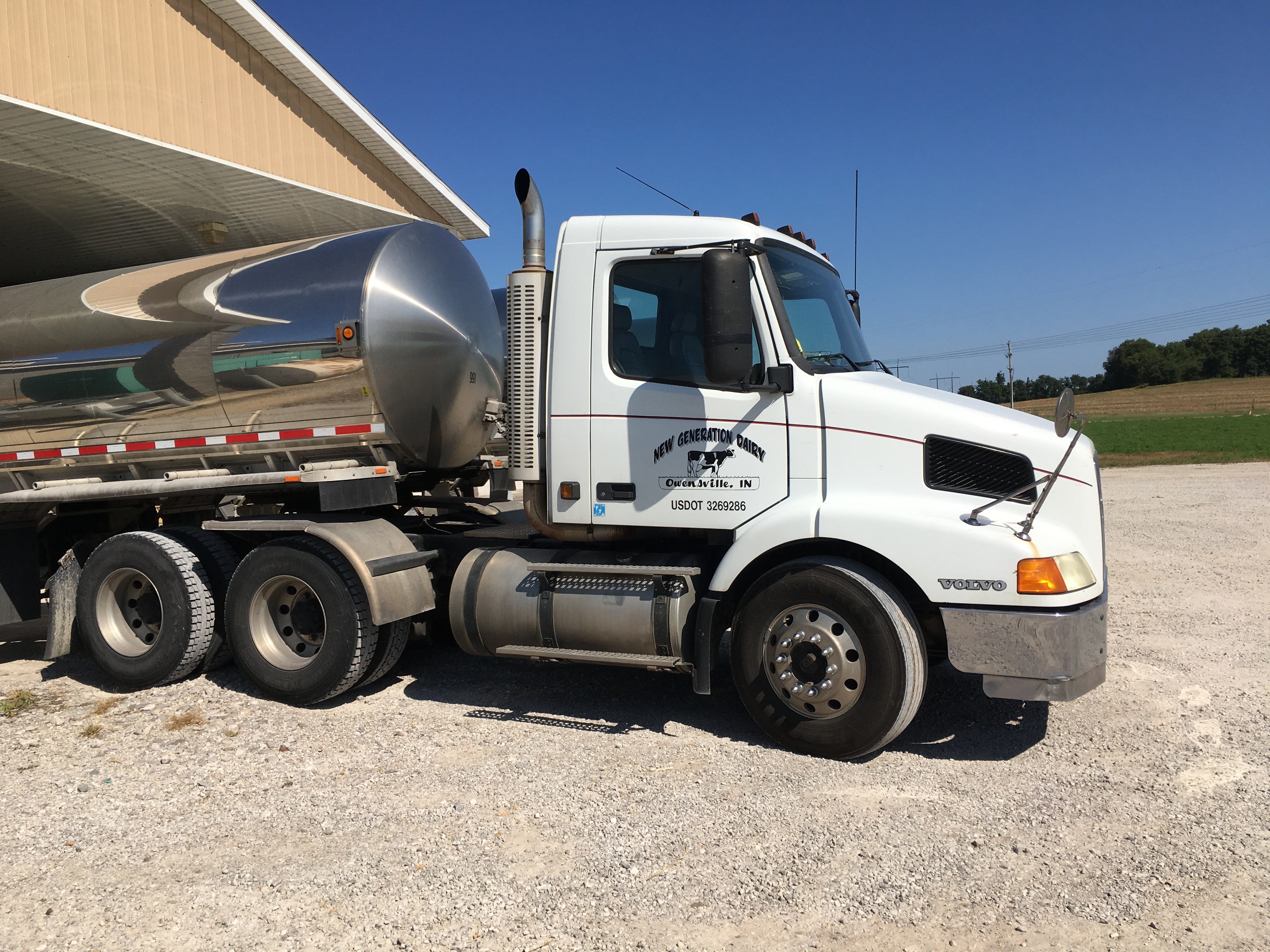 A truck for Brian Rexing's New Generation Dairy farm in Owensville, Ind., sits at the farm. In March, Rexing had to dump nearly 30,000 gallons of milk — or five semi-loads — as the coronavirus has wreaked havoc on the dairy industry and demand has decreased with the closure of restaurants and schools and limits at grocery stores.