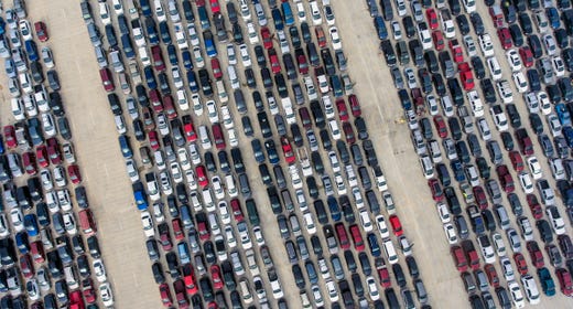 People wait in their cars Thursday, April 9, 2020, at Traders Village for the San Antonio Food Bank to begin food distribution. The need for emergency food aid has exploded in recent weeks due to the coronavirus epidemic.