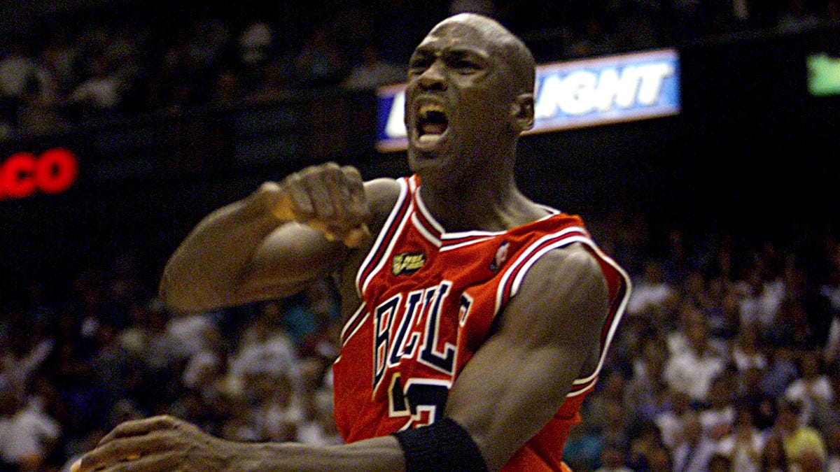 Michael Jordan celebrates after winning the 1998 NBA championship.