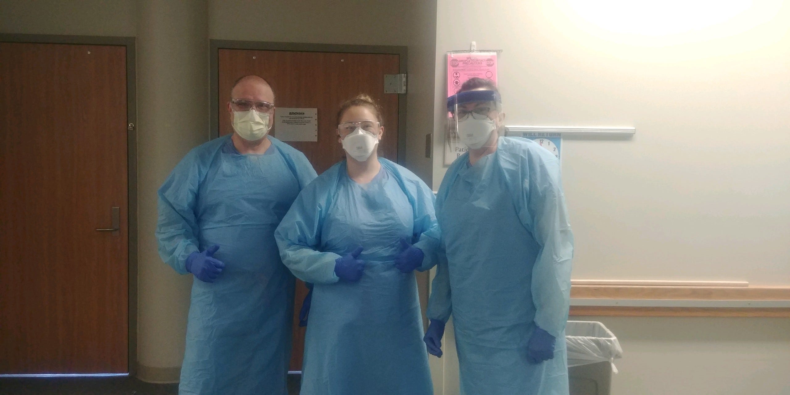 Darrell Owens (left) prepares to make rounds at the University of Washington Medical Center-Northwest on April 9, 2020. As the director of the hospital's palliative care program, Owens has overseen the cases of all COVID-19 patients, forcing him to speak with all their families and sign dozens of death certificates since the outbreak hit the Seattle area.