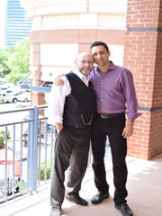 Gino Teyf (left) and his son Alex own a trio of barber shops in Atlanta that have had to close because of the coronavirus crisis.